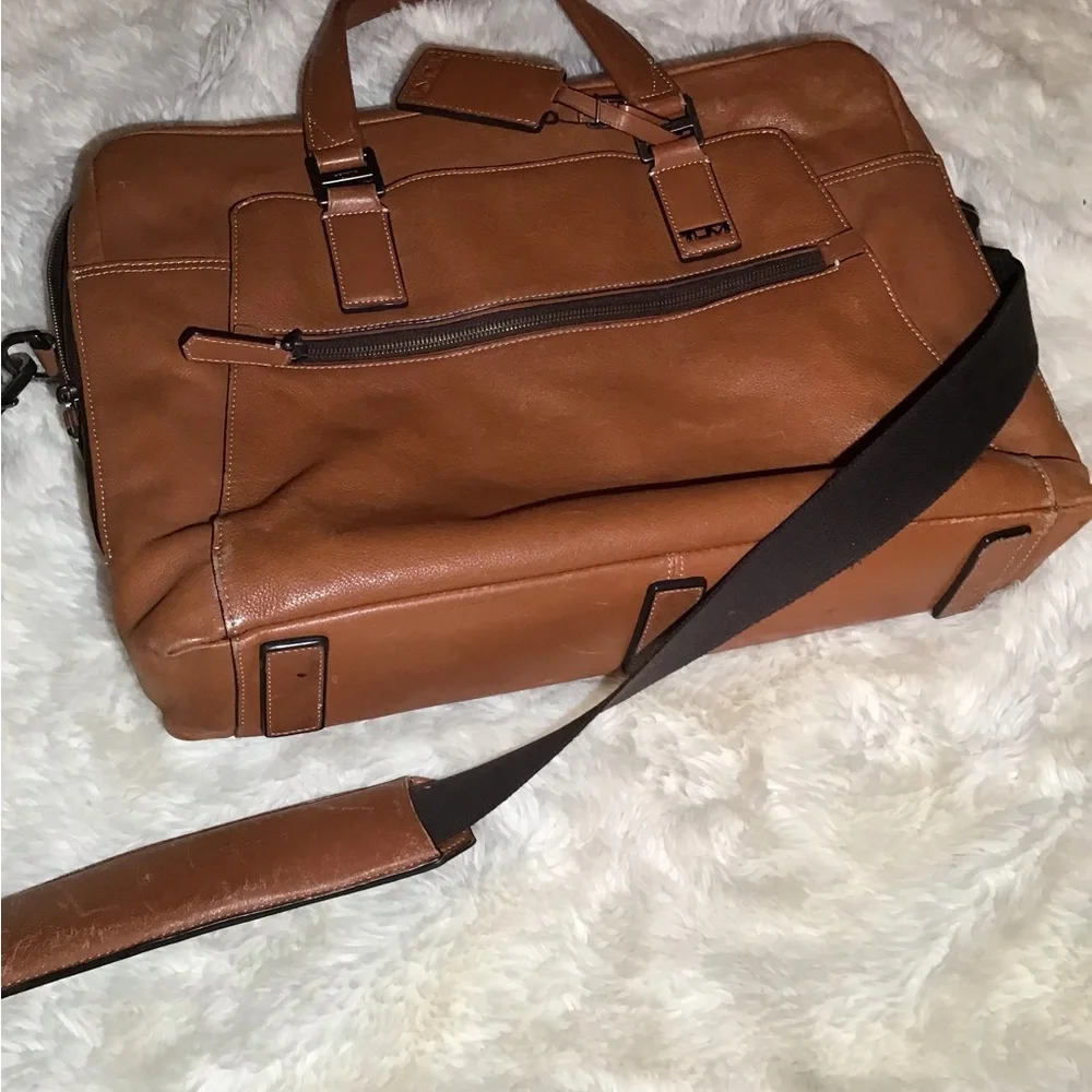 Tumi worn but